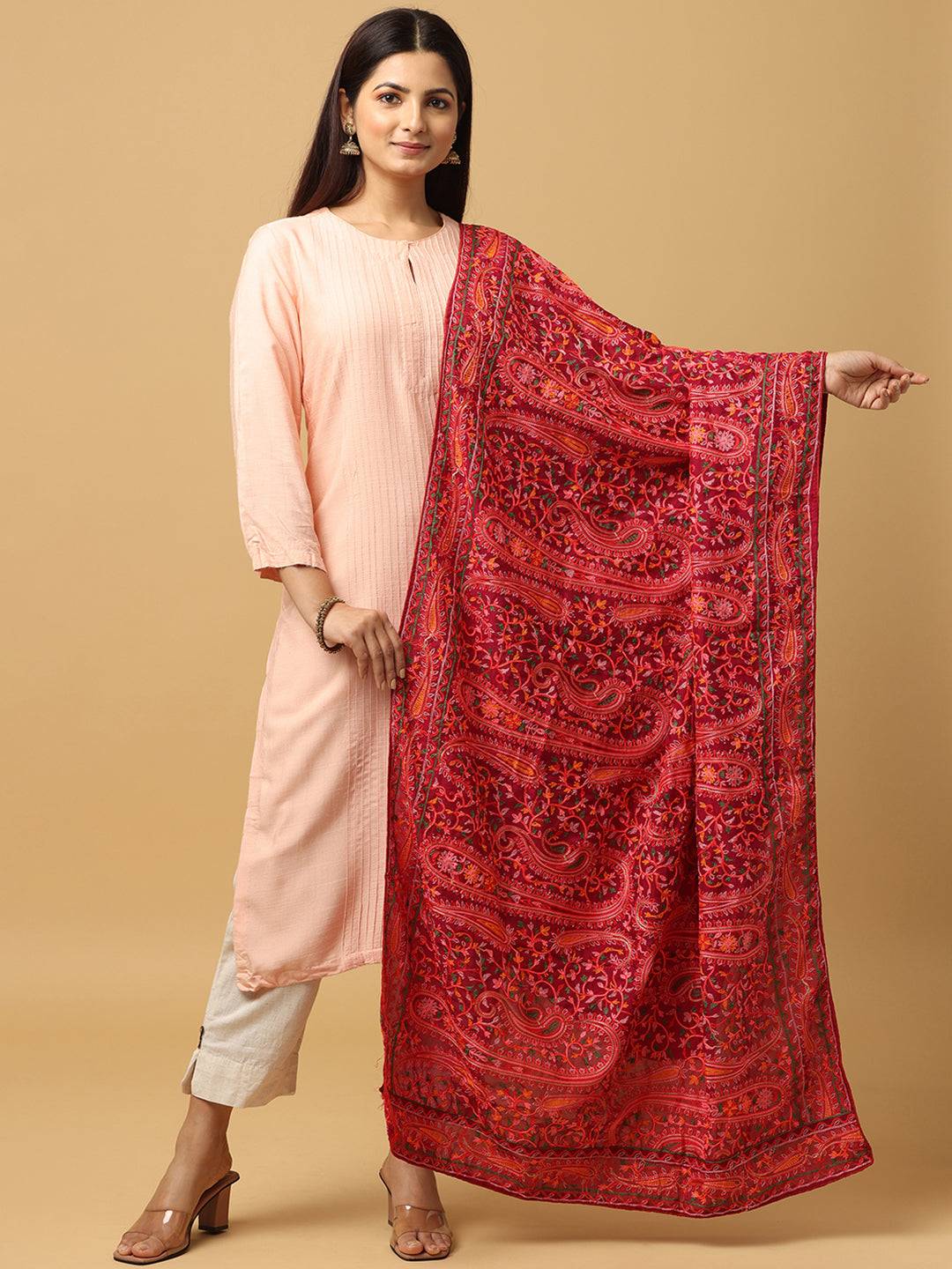 Red embroidered dupatta with intricate ethnic motifs.