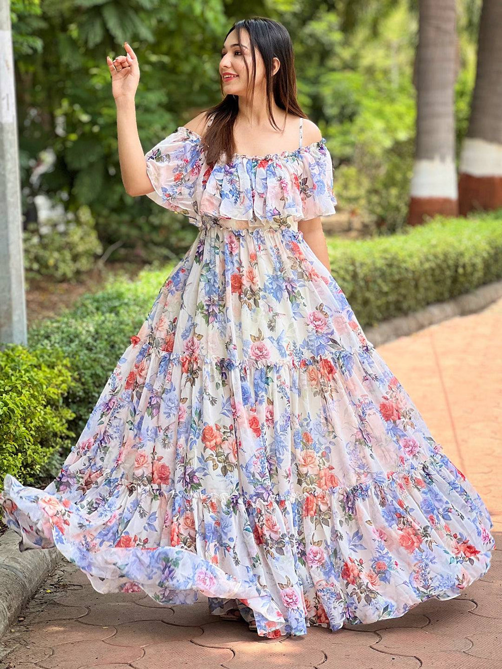 Woman twirling in floral maxi dress outdoors