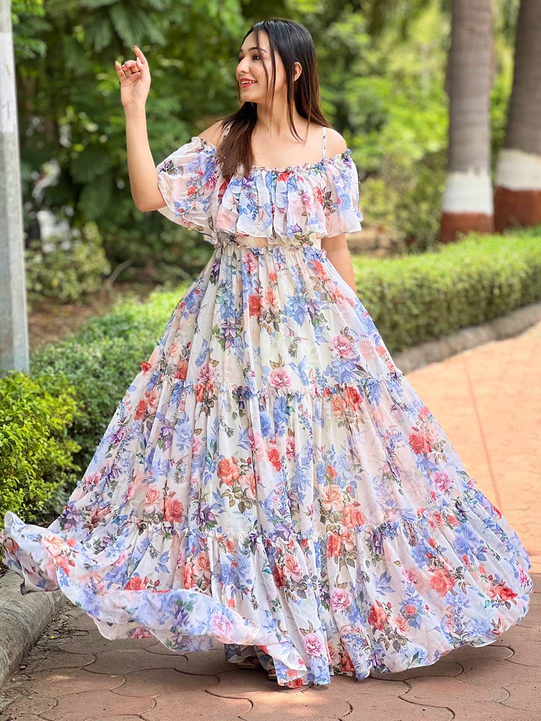 Woman twirling in floral maxi dress outdoors