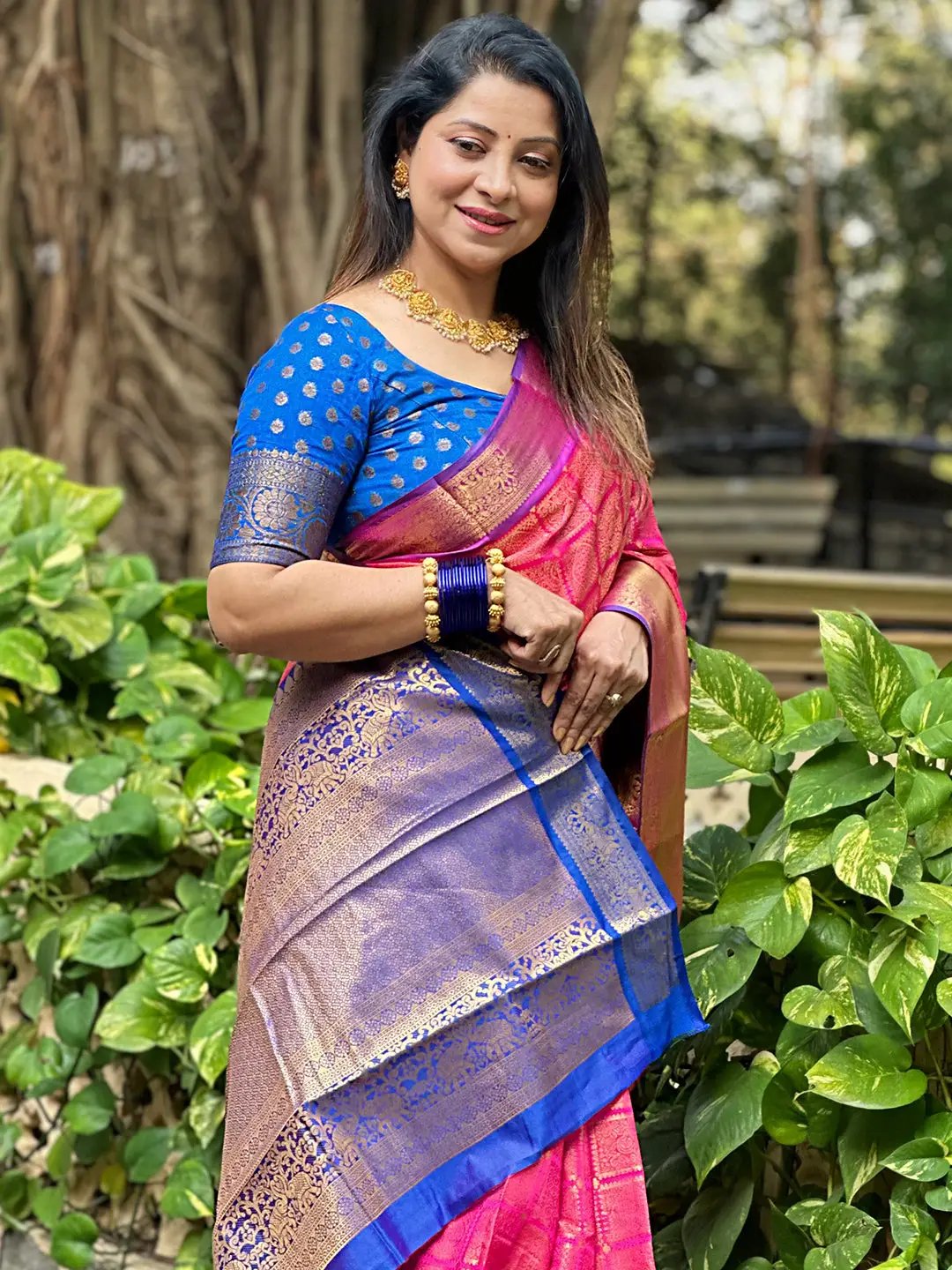 Traditional pink Kanjivaram saree with blue blouse