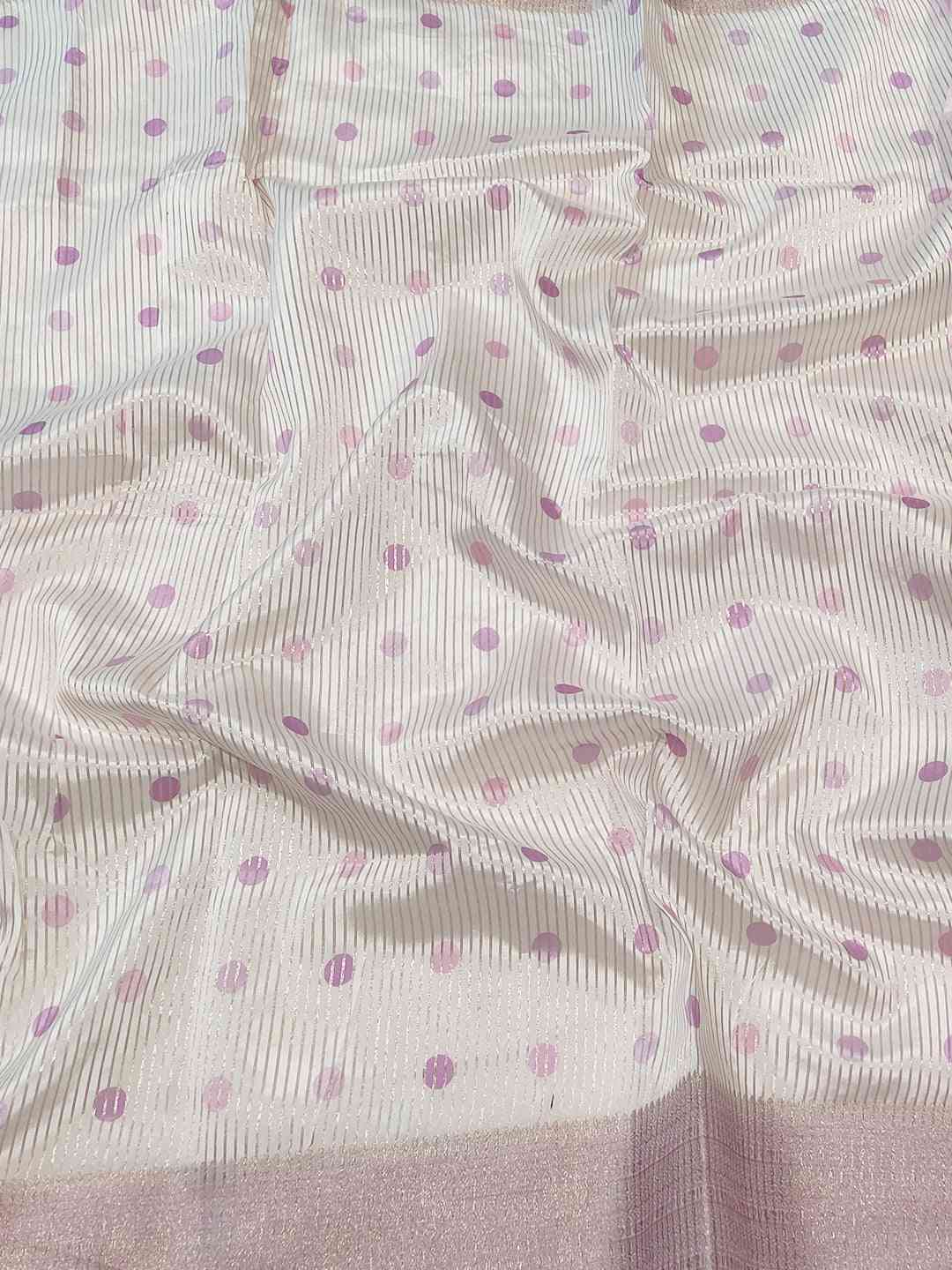 Close-up of soft organza saree with polka dot pattern