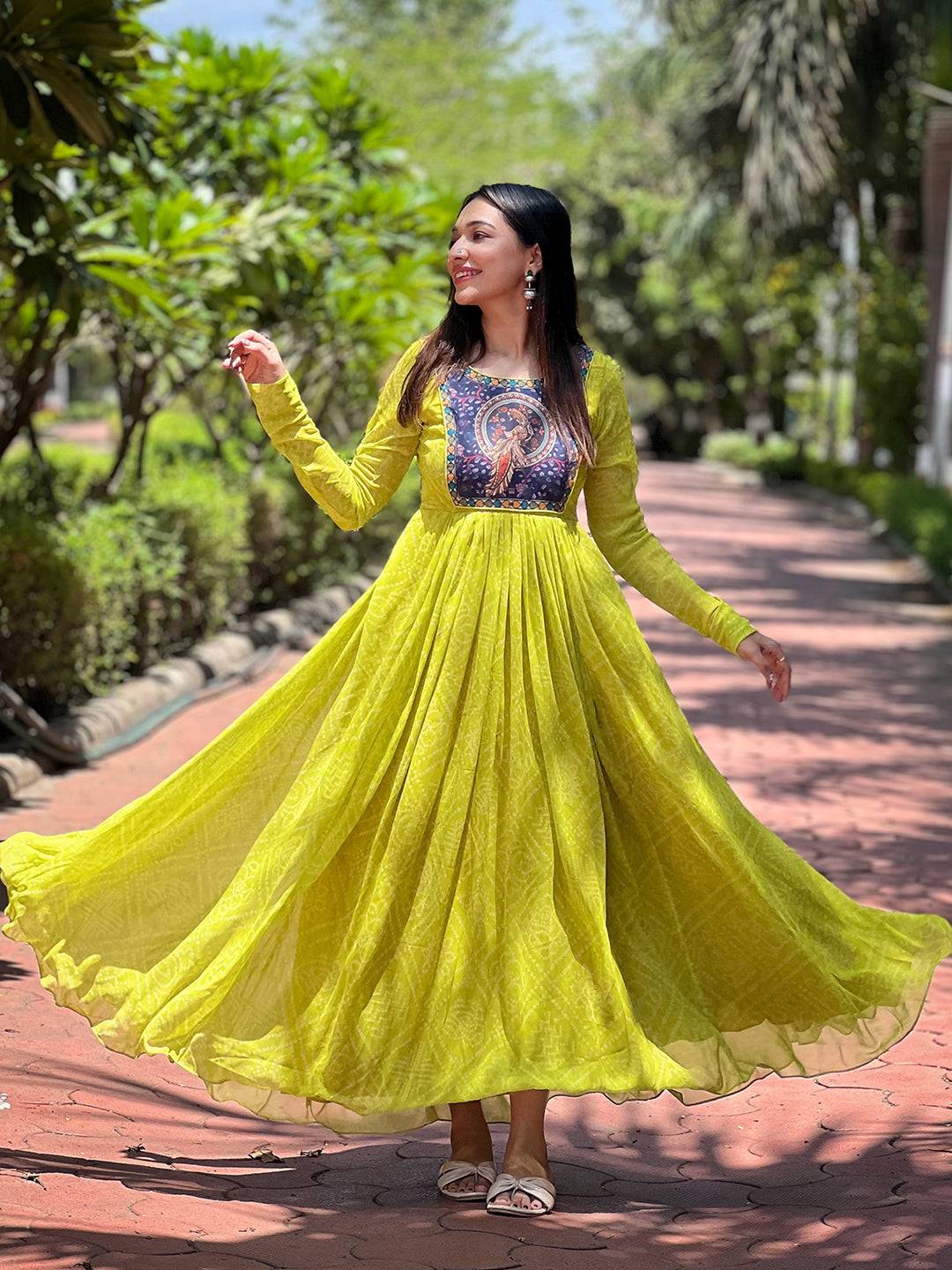 Model twirling in Pea Green Bandhej Dress