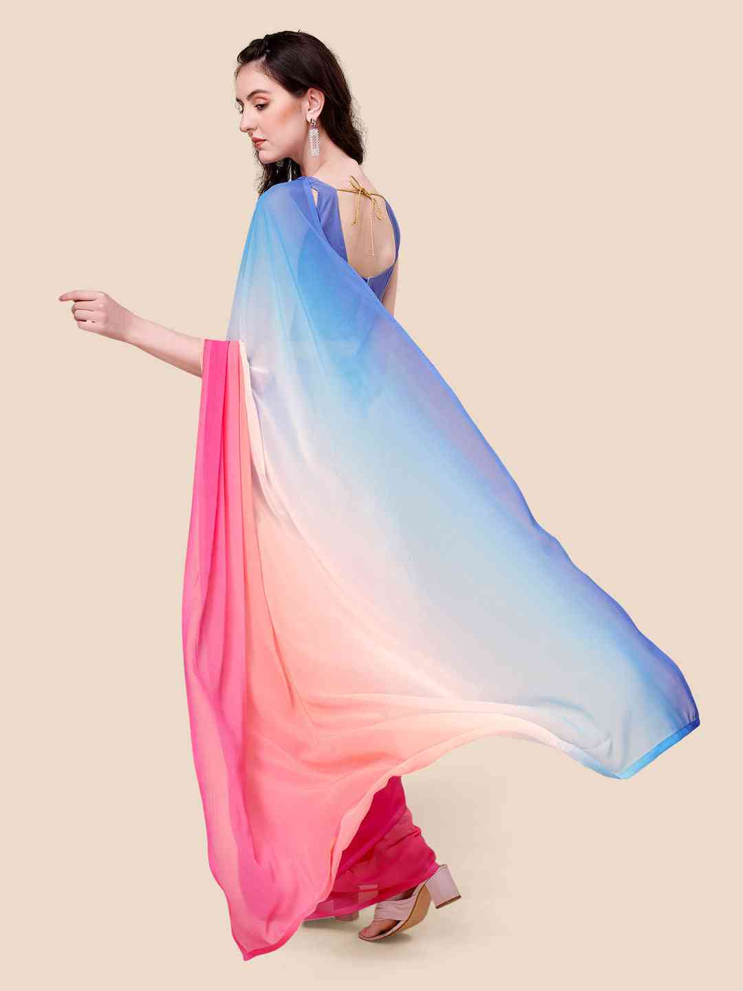 Back view of ombre saree with flowing blue to pink gradient design.