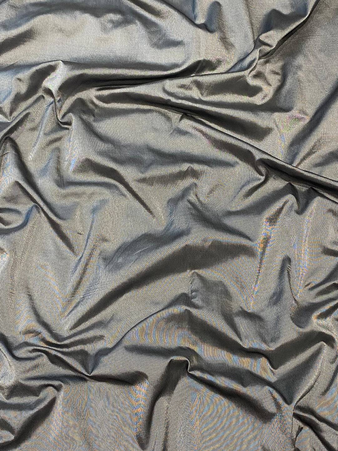 Close-up of black soft silk fabric with subtle sheen