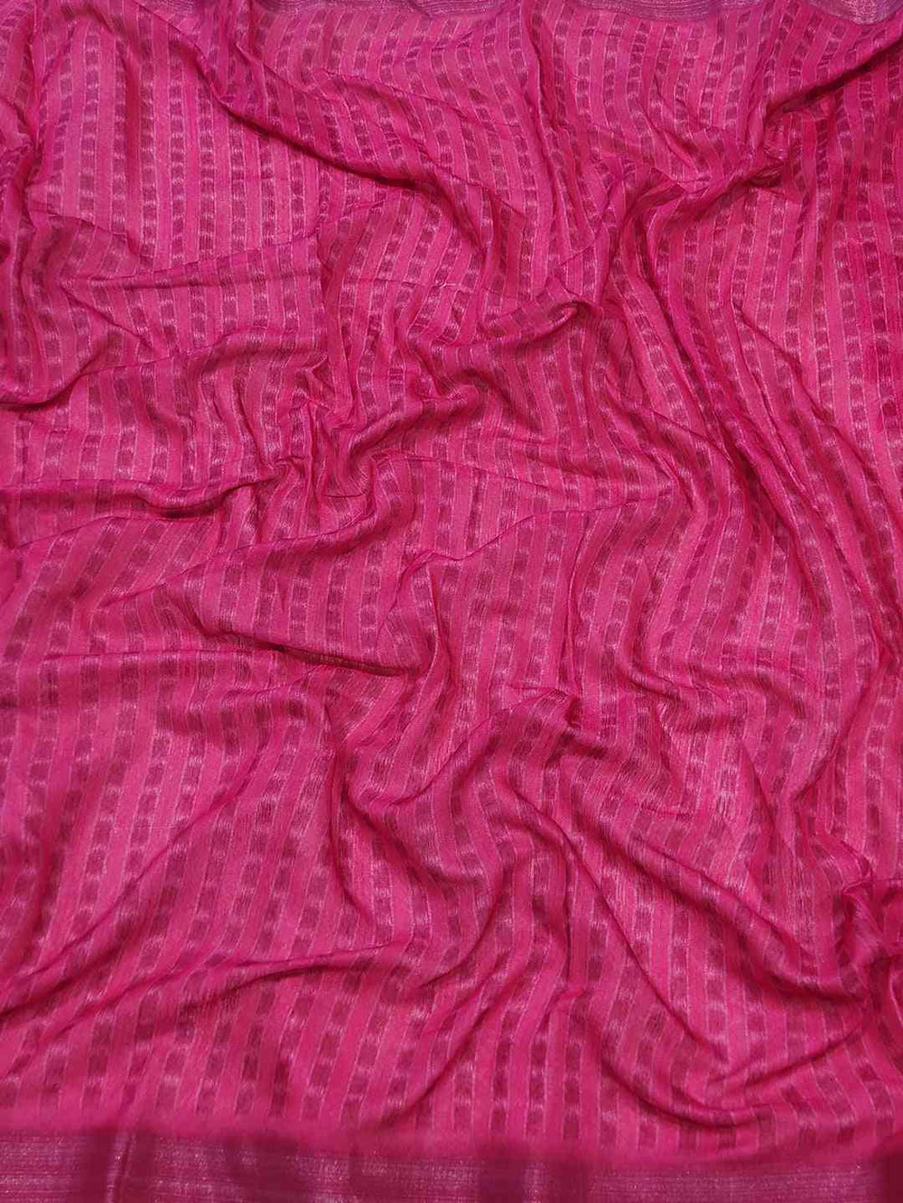 Close-up of pink fabric with striped pattern