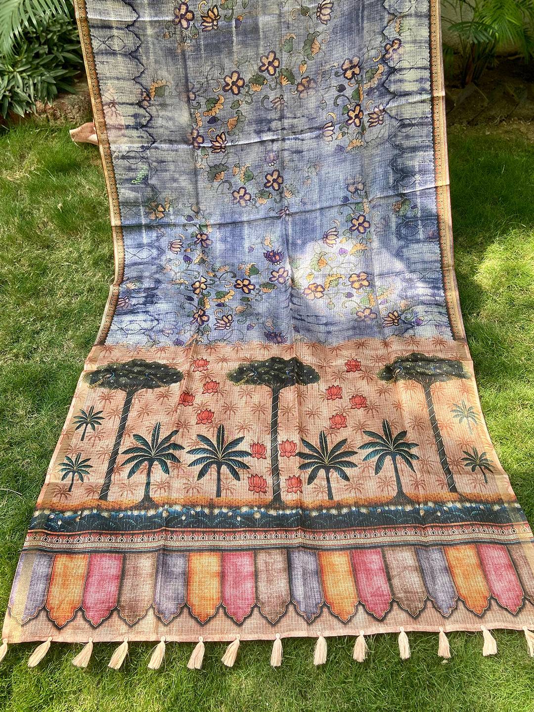 Full view of blue Kota Doriya silk saree with floral and tree motifs.
