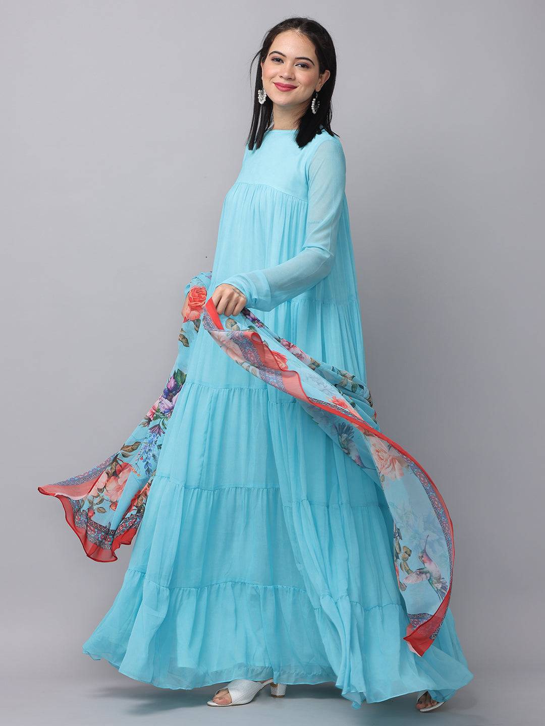 Powder blue dress with vibrant dupatta, twirling pose