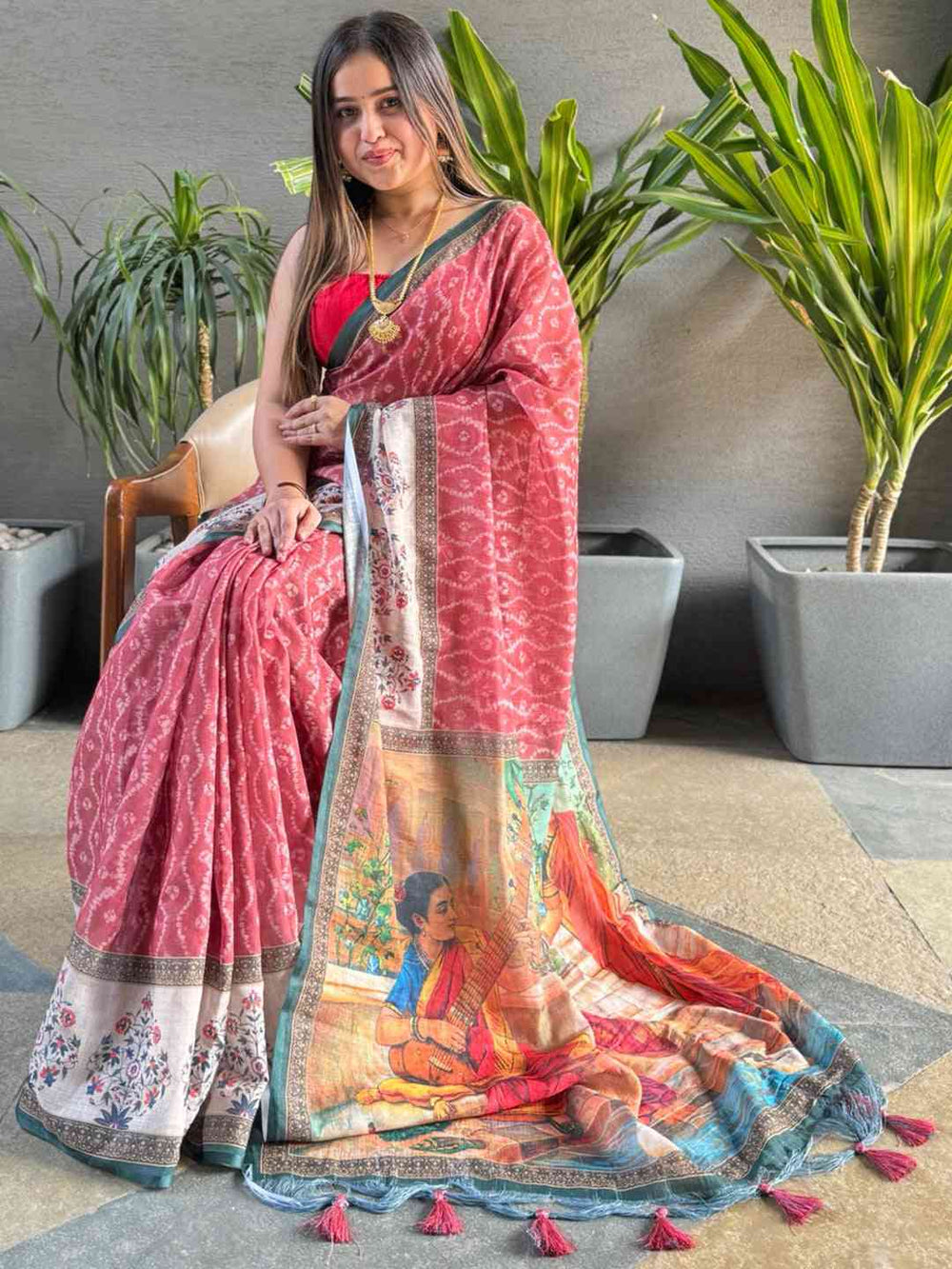 Gajari Ikkat saree with Kalamkari design, model seated