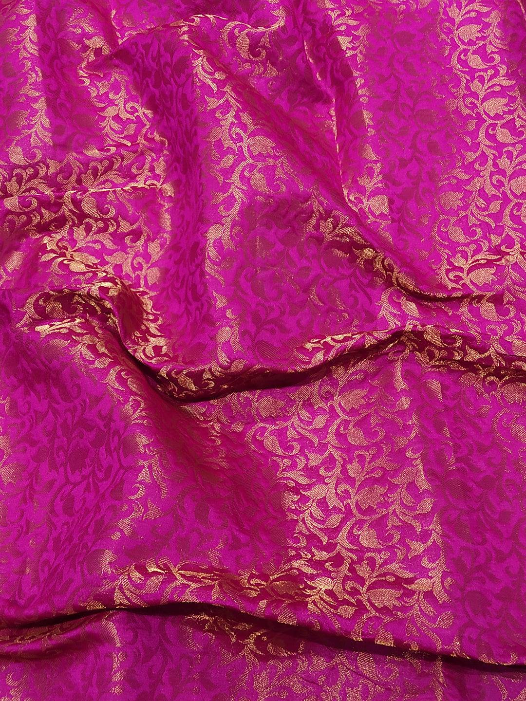 Close-up of pink Kanjivaram weaving on silk fabric