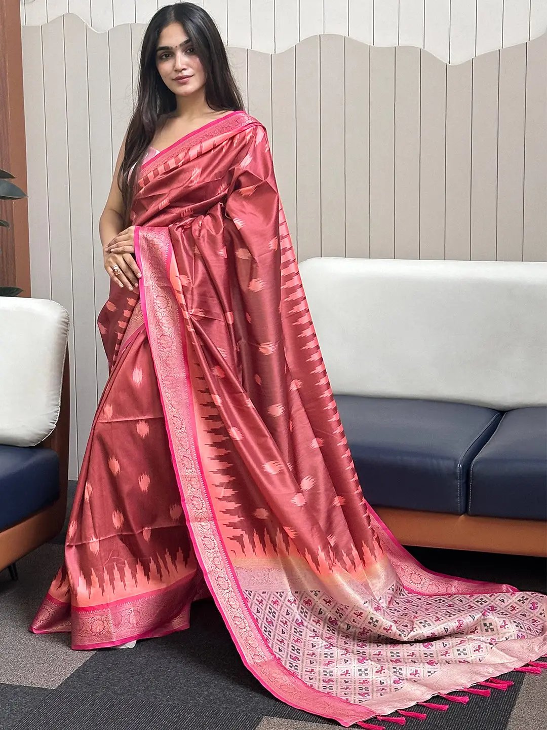 Elegant soft silk Banarasi saree with zari patola pallu draped.