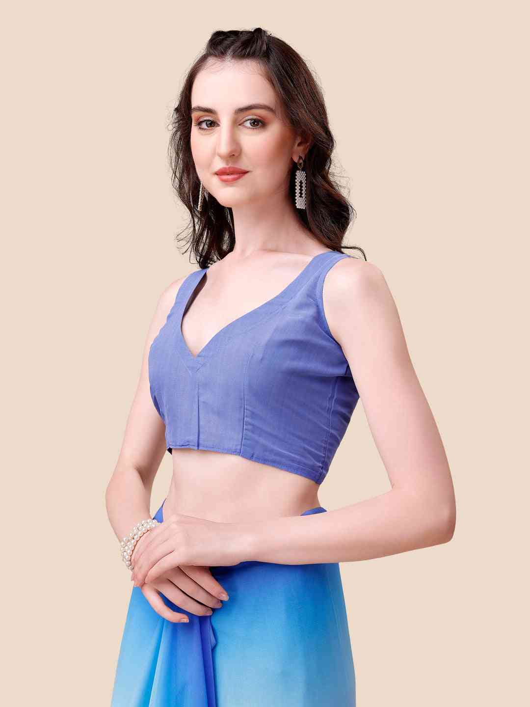 Model in blue blouse paired with Bollywood ombre saree.