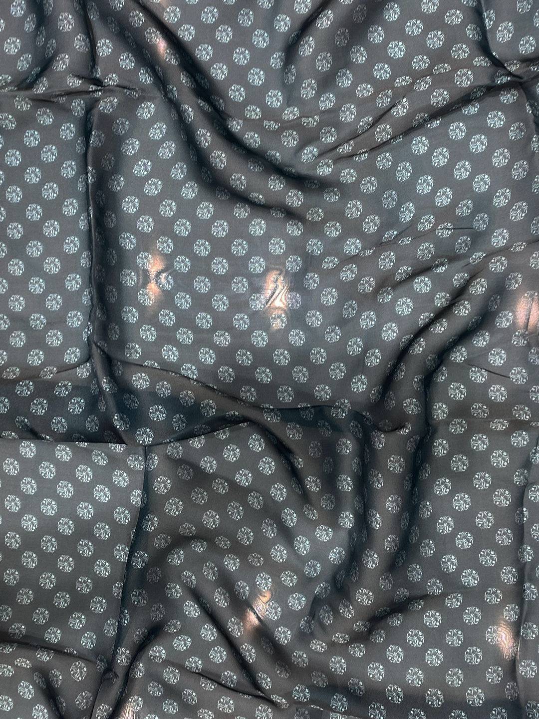 Close-up of dark blue patterned fabric with floral design