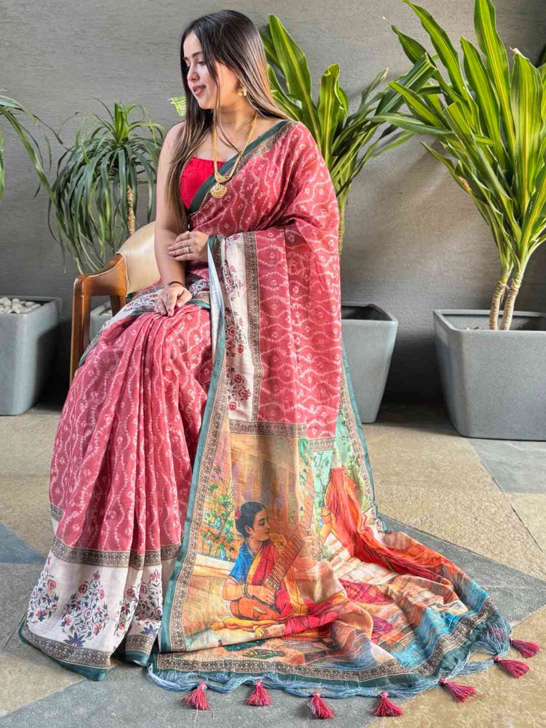 Gajari Ikkat saree with Kalamkari design, model seated