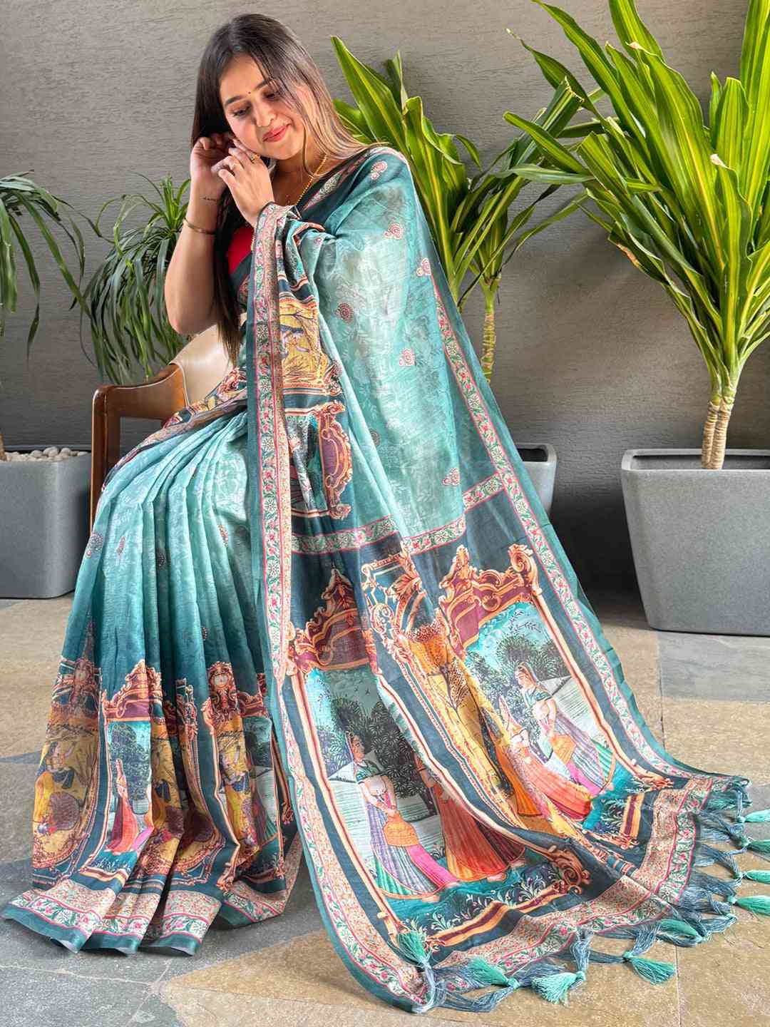 Turquoise saree with vibrant digital print and detailed border