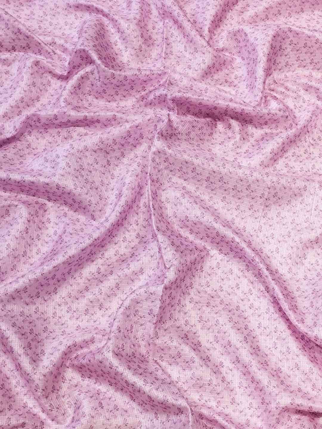 Textured pink fabric with subtle floral pattern