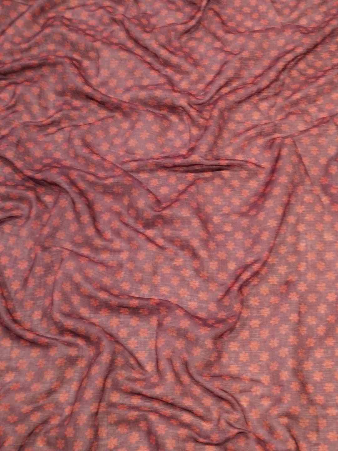 Close-up of fabric with intricate kalamkari print design