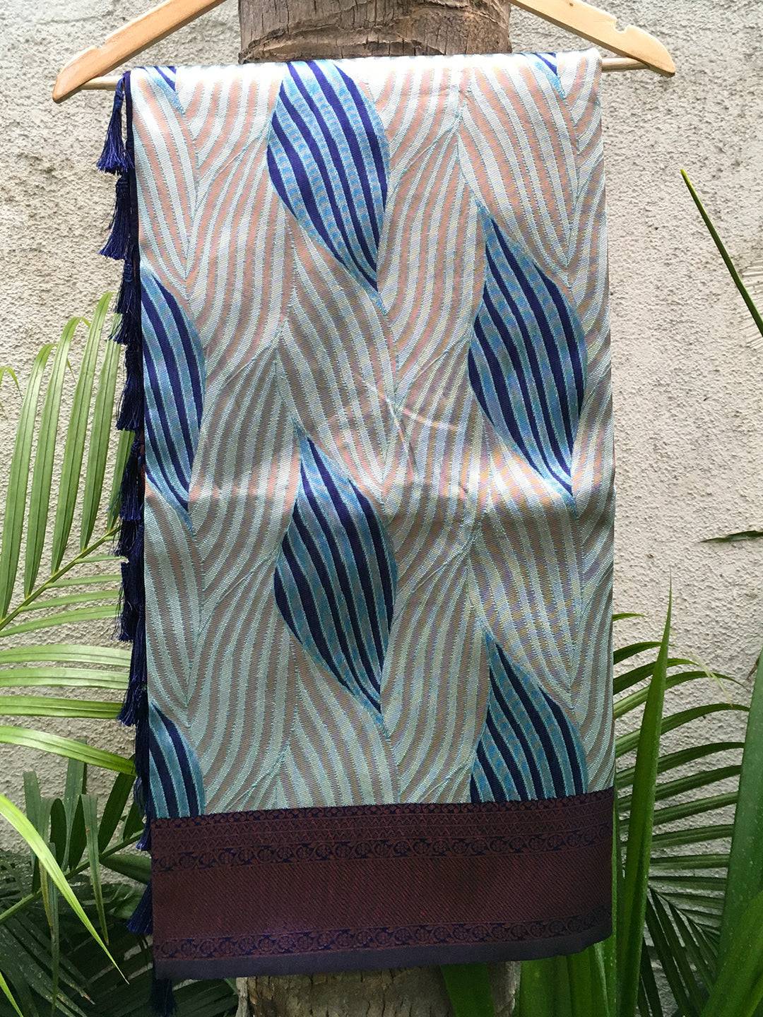 Sky blue Tussar silk Ikkat saree with abstract print on hanger.
