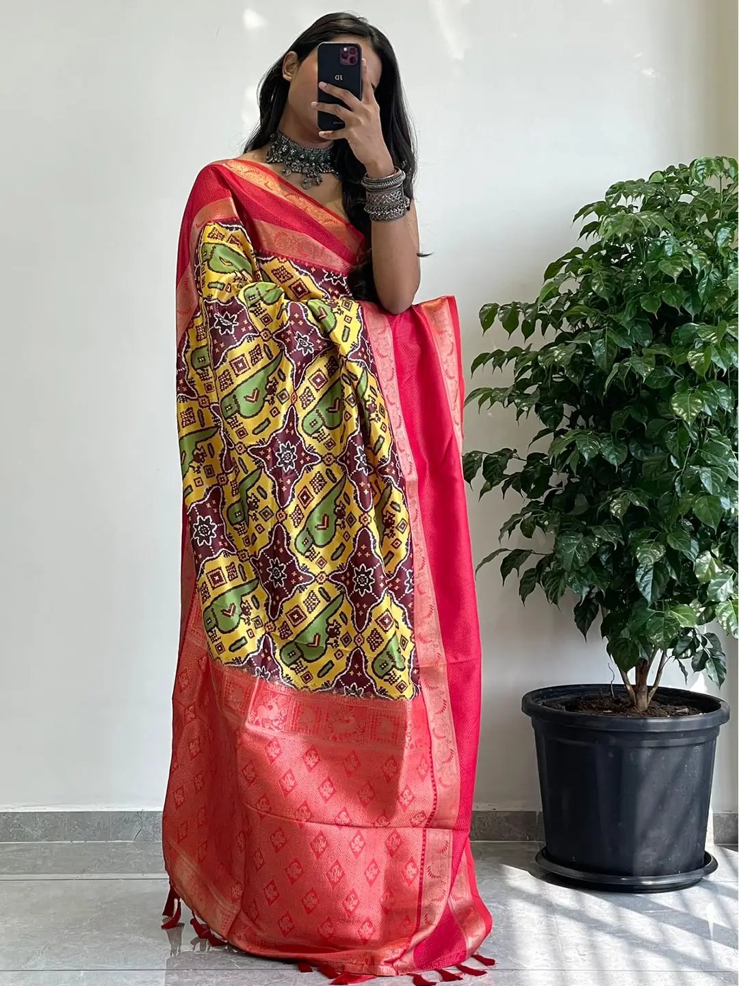 Vibrant Pochampally print saree with intricate Gadwal border.