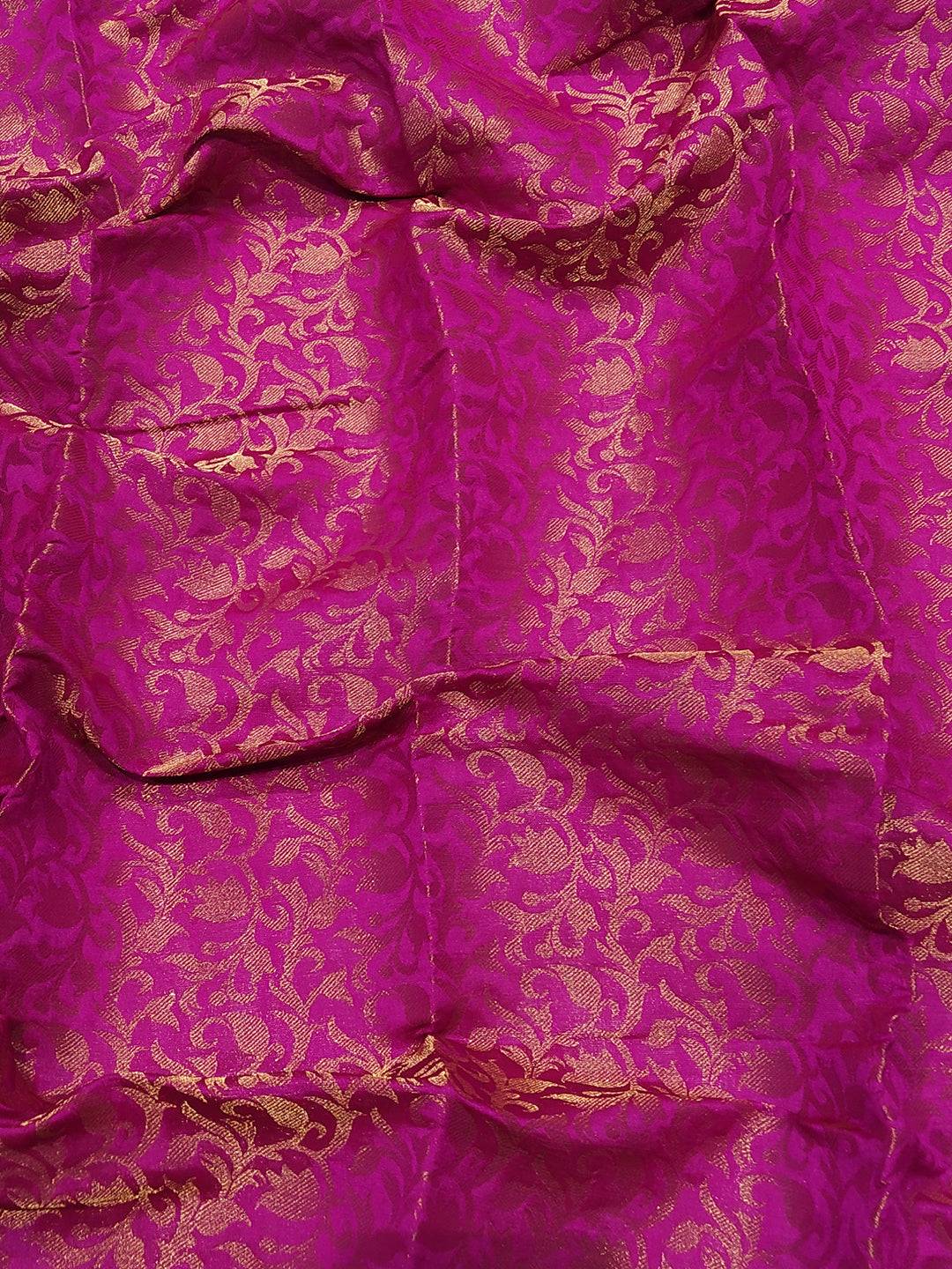 Close-up of pink Kanjivaram weaving on silk fabric