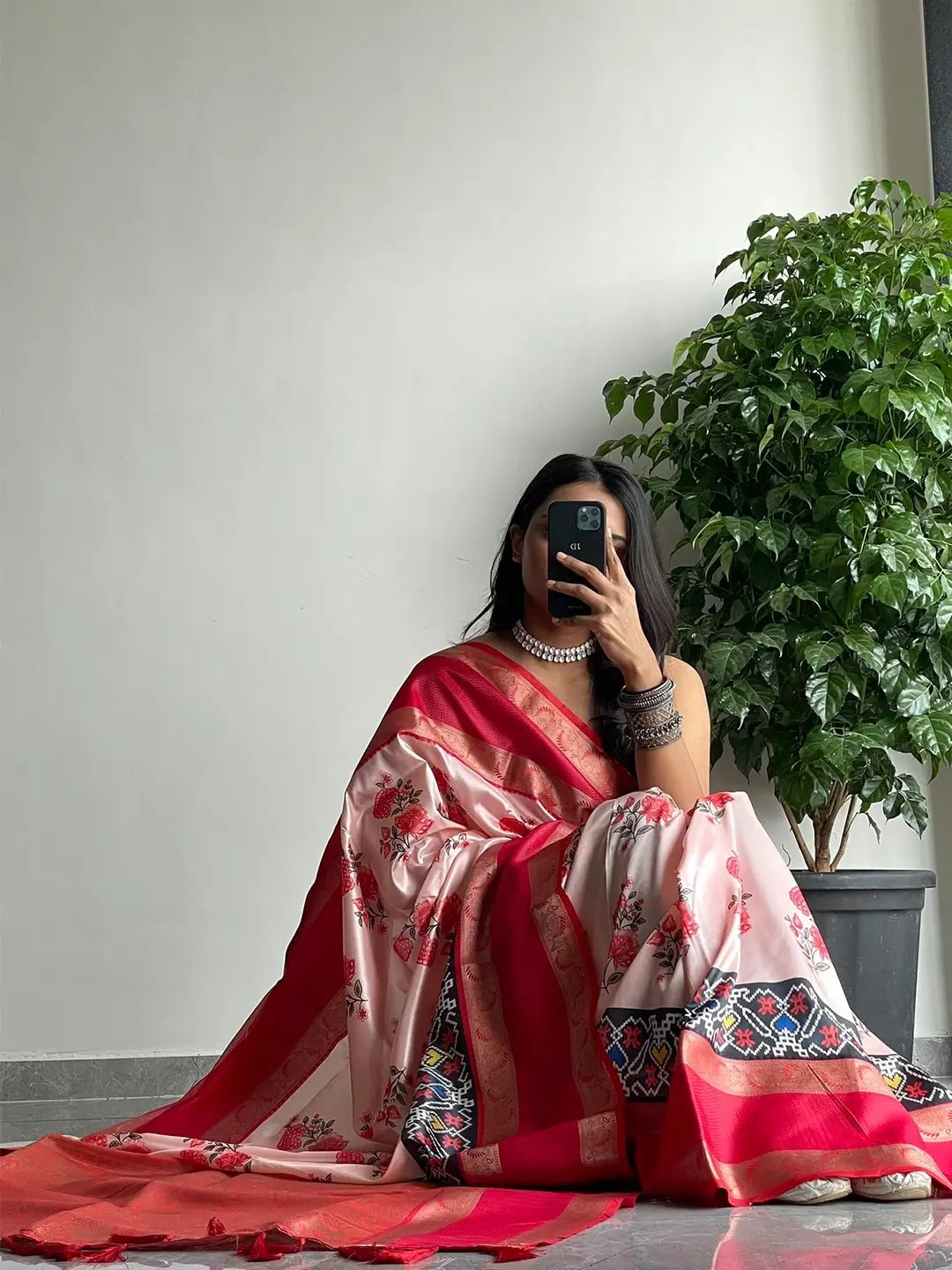 Chic soft silk saree with red Gadwal border and floral Pochampally design