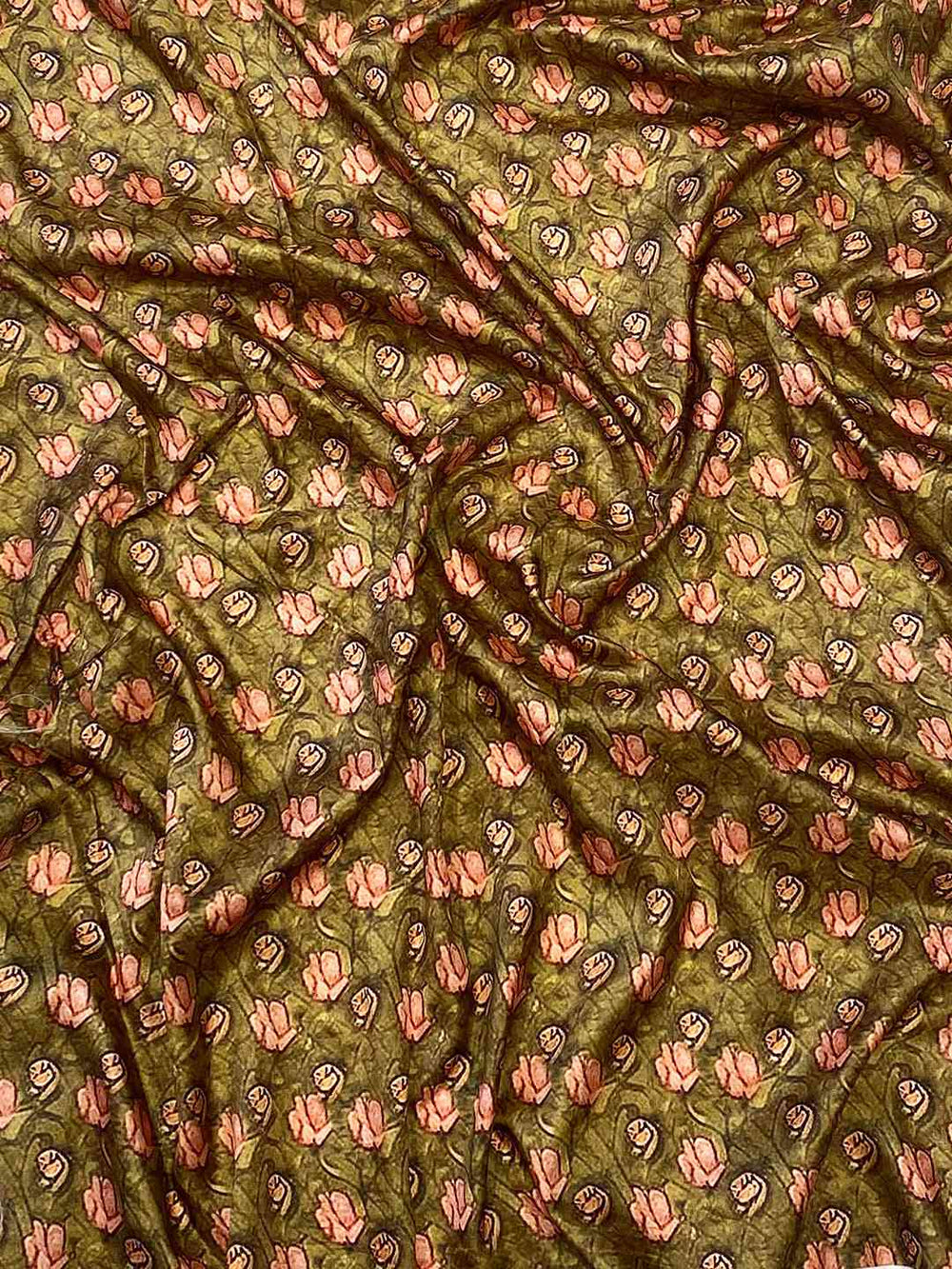 Green fabric with intricate floral Mughal print design