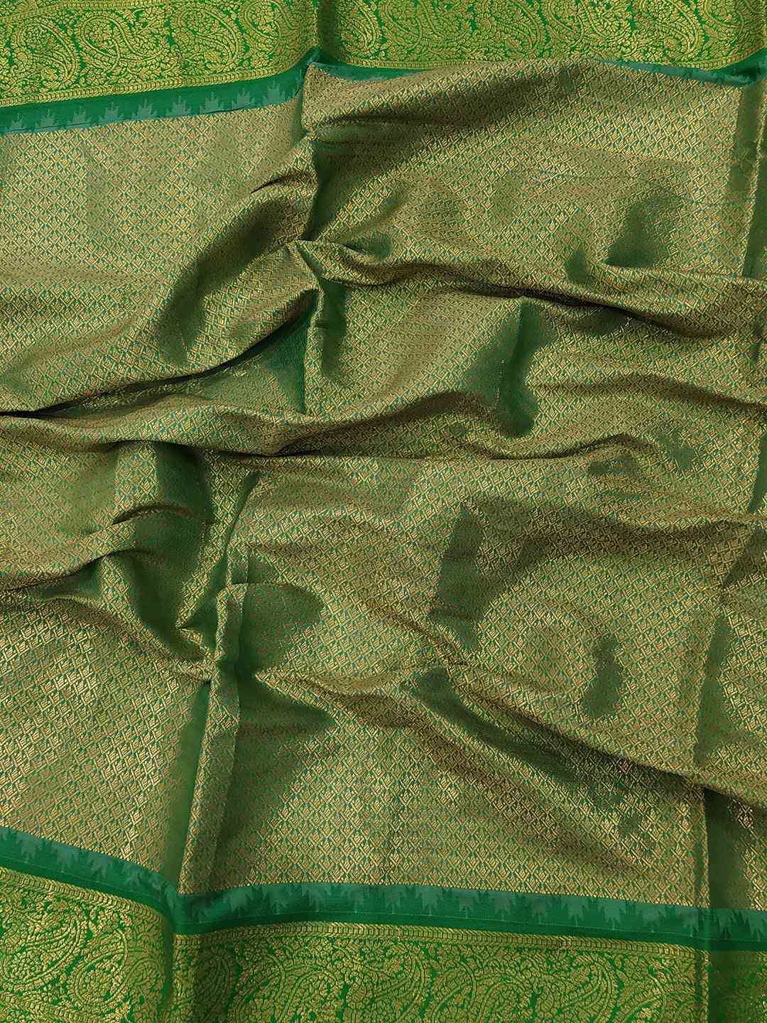 Close-up of green zari weaving on Gadwal saree border