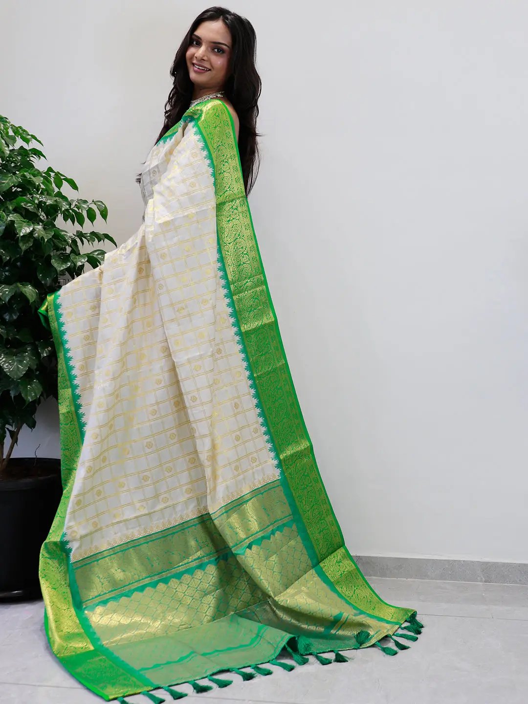 Soft silk Gadwal saree showcasing intricate green border