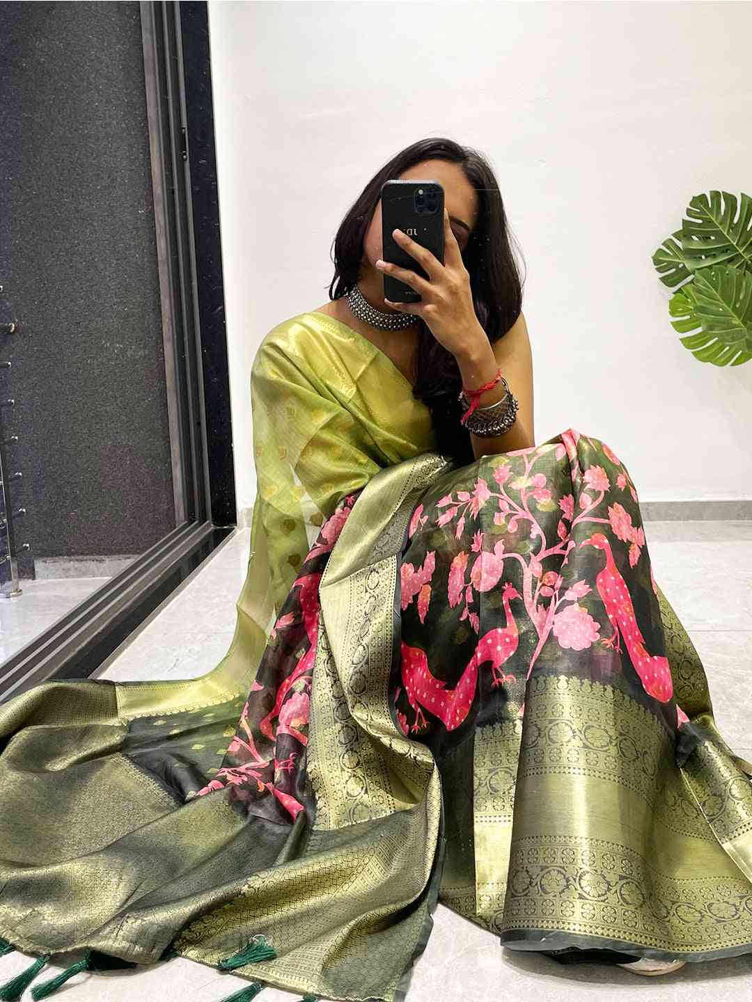 Model seated wearing Kalamkari Printed Kota Doriya Saree