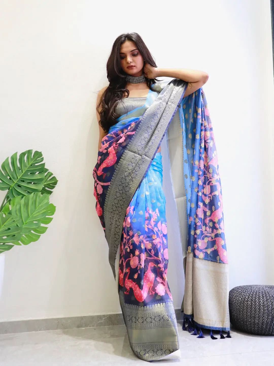Model showcasing vibrant Kalamkari printed Kota Doriya saree.