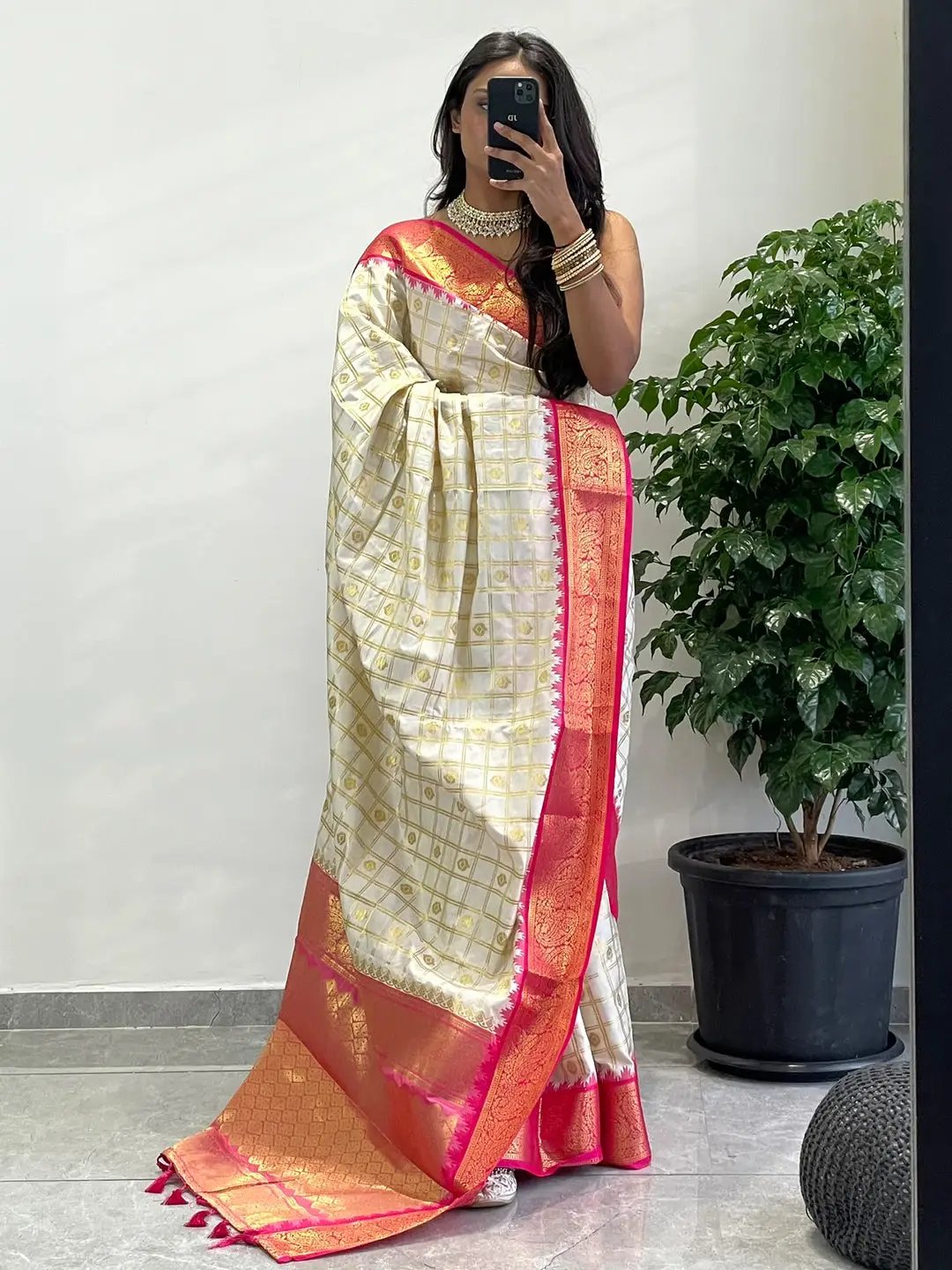 Gadwal saree with exquisite pink temple border worn by model.