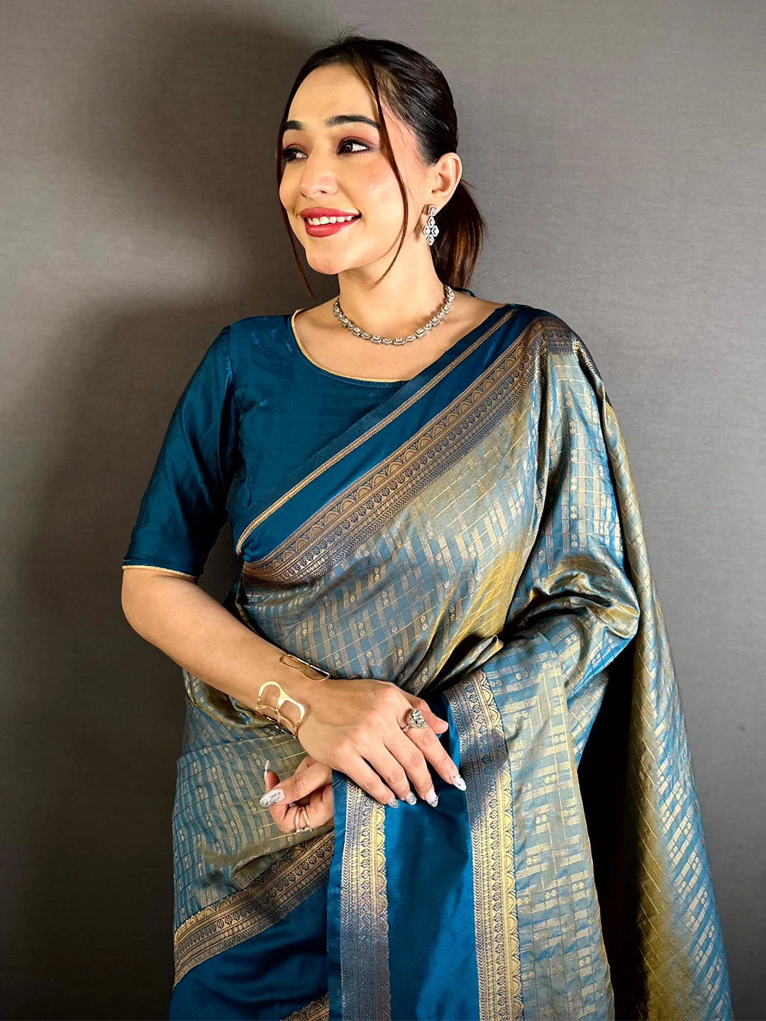 Teal Soft Silk Gold Checked Butta Saree, front drape on model showing the Gadwal border and blouse