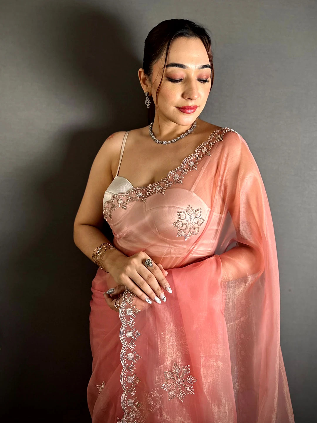 Elegant Peach Tissue Pearl Diamond Work Saree