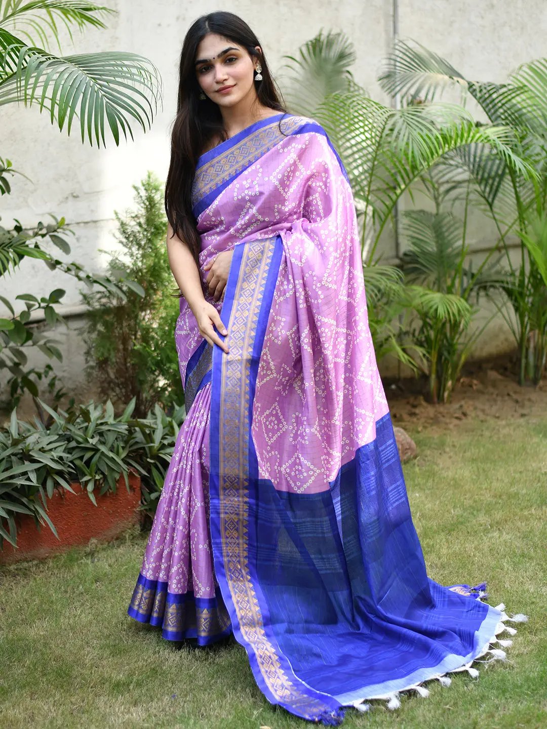 Fine crafted soft silk Bandhej saree with intricate design.