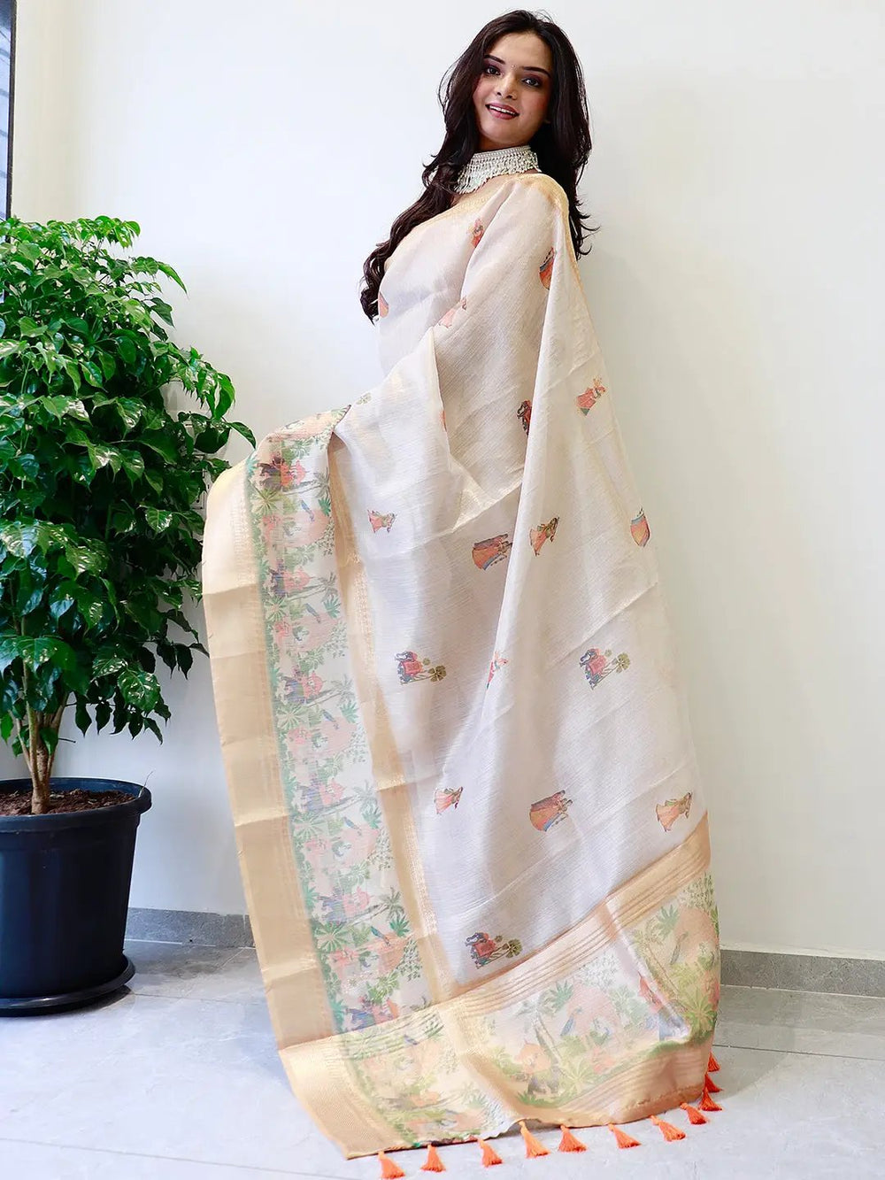 Traditional soft gold tissue saree with intricate prints