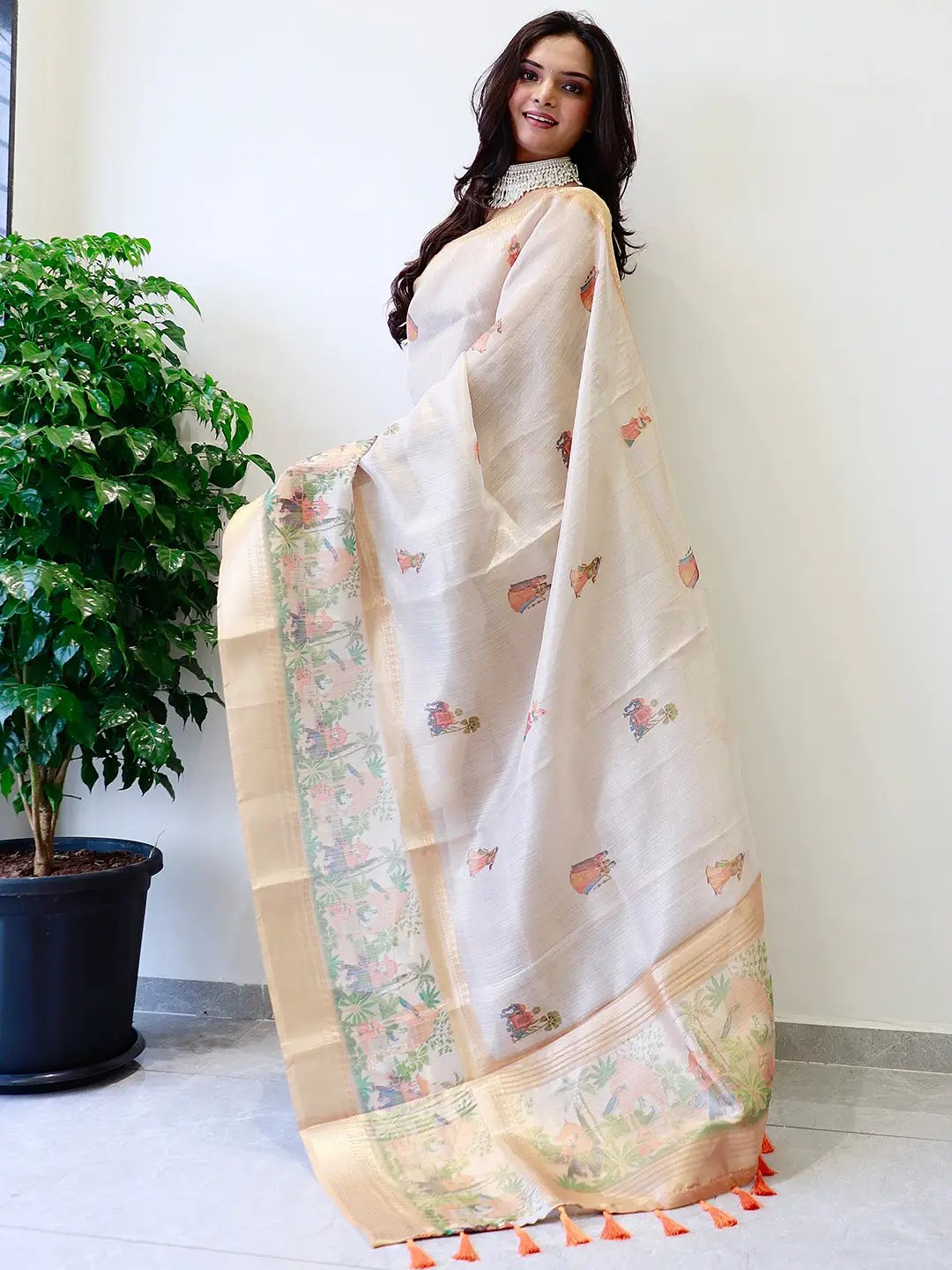 Traditional soft gold tissue saree with intricate prints