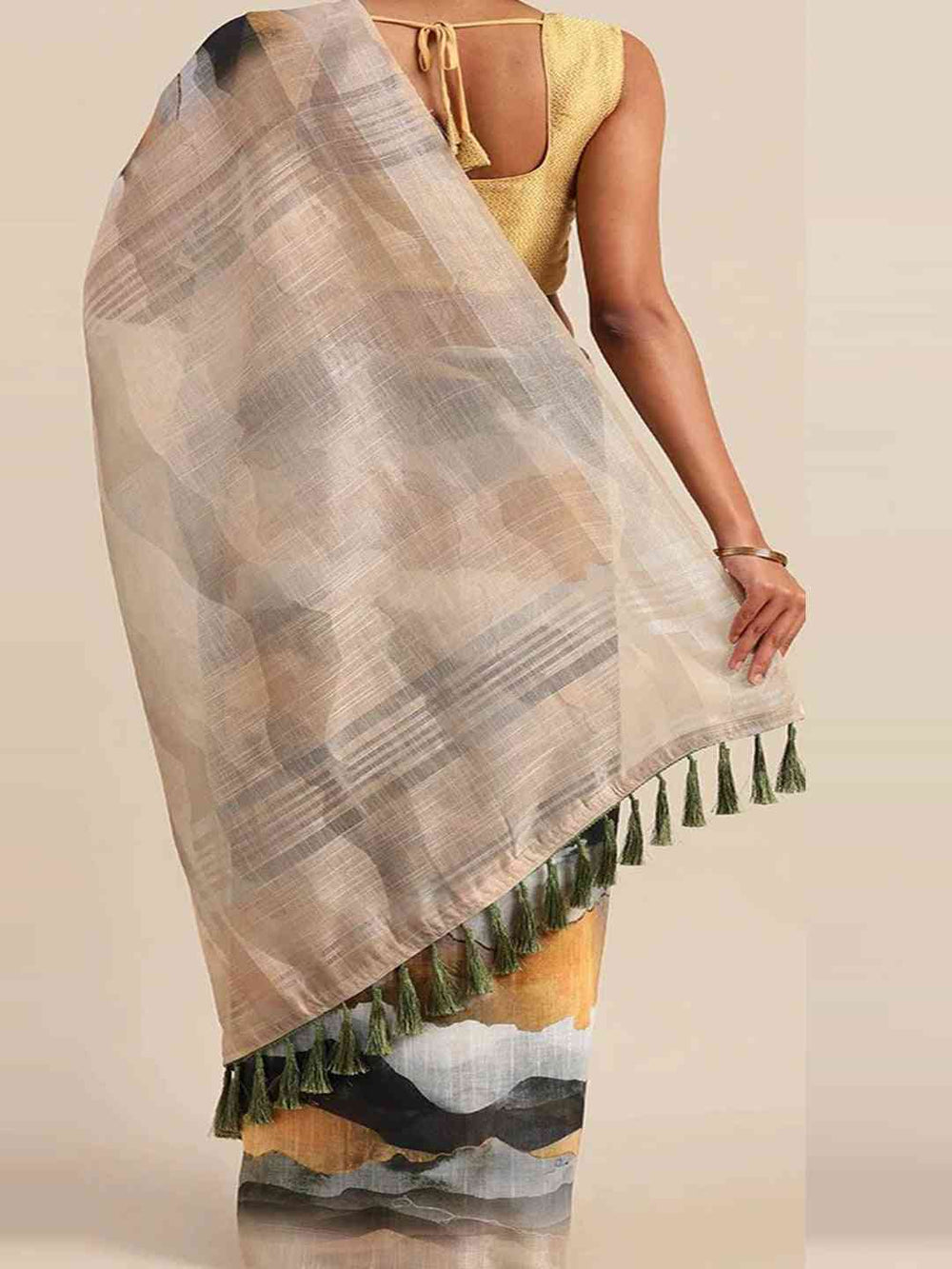 Back view of beige linen saree with tassels