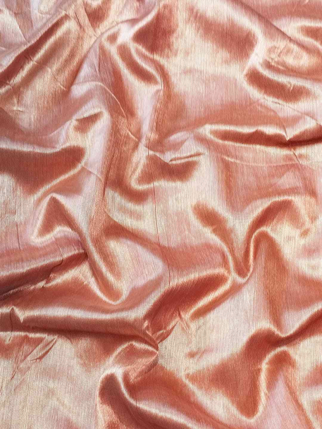 Texture of Slub Tussar Silk fabric in peach color