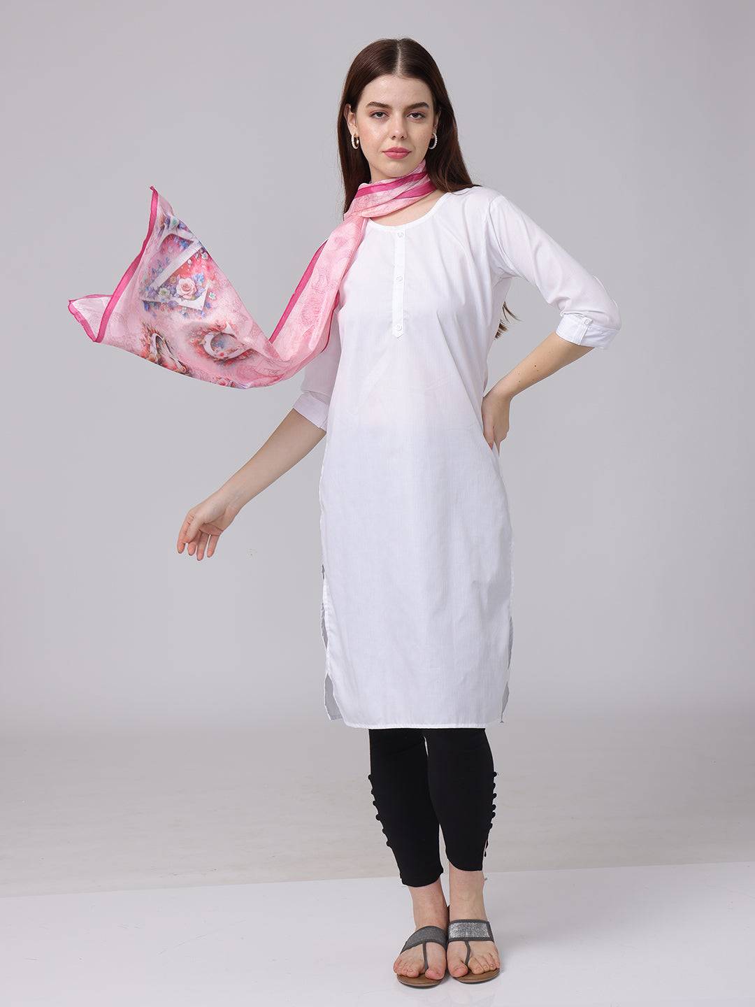 Pink cursive script patterned scarf flowing in motion with white attire.