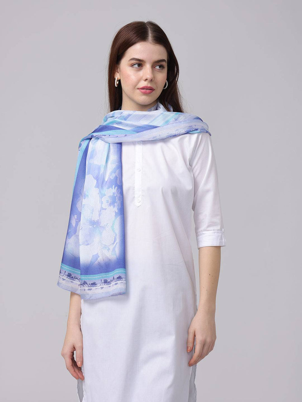 Serene blue floral scarf draped over shoulder