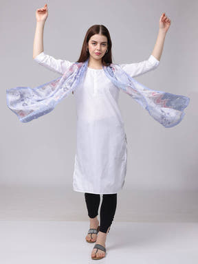 Model showcasing flowing ethnic motifs scarf