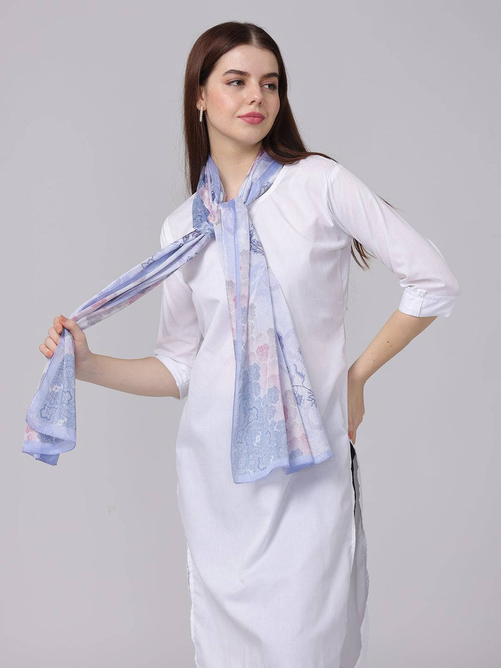 Model wearing ethnic motifs patterned scarf in blue, pink, gray