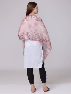 Back view of crepe pink floral printed scarf draped over shoulders