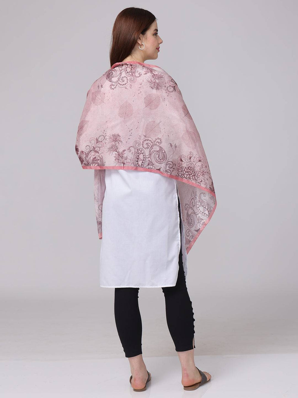 Back view of crepe pink floral printed scarf draped over shoulders