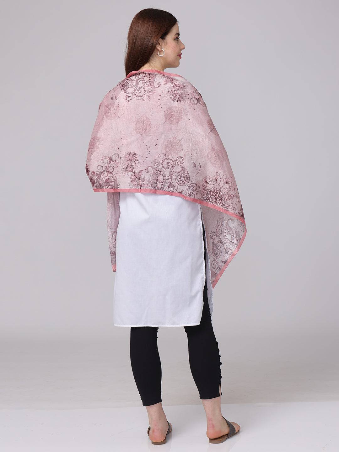 Back view of crepe pink floral printed scarf draped over shoulders
