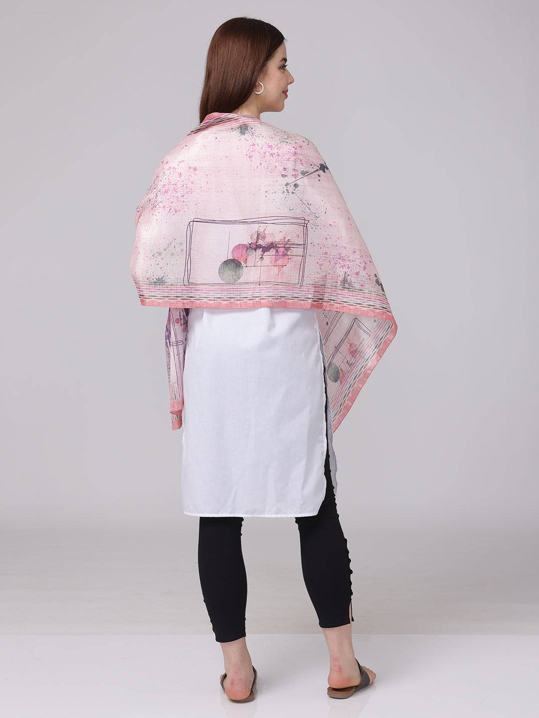 Back view of abstract printed blossom scarf draped over shoulders.