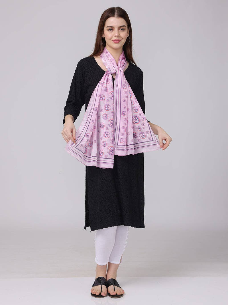 Vibrant circular printed scarf in pink and purple, front view.