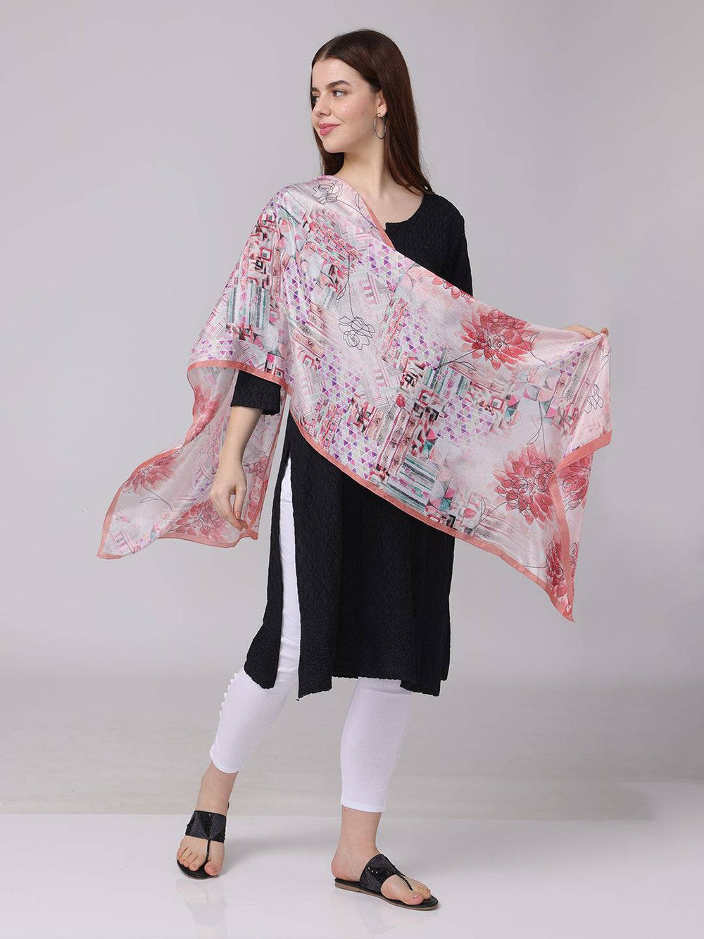 Floral and geometric print scarf draped over shoulder
