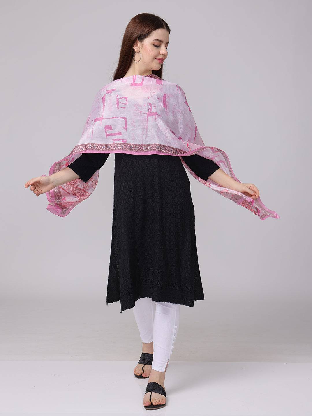 Graceful pink paisley and floral scarf draped over shoulders