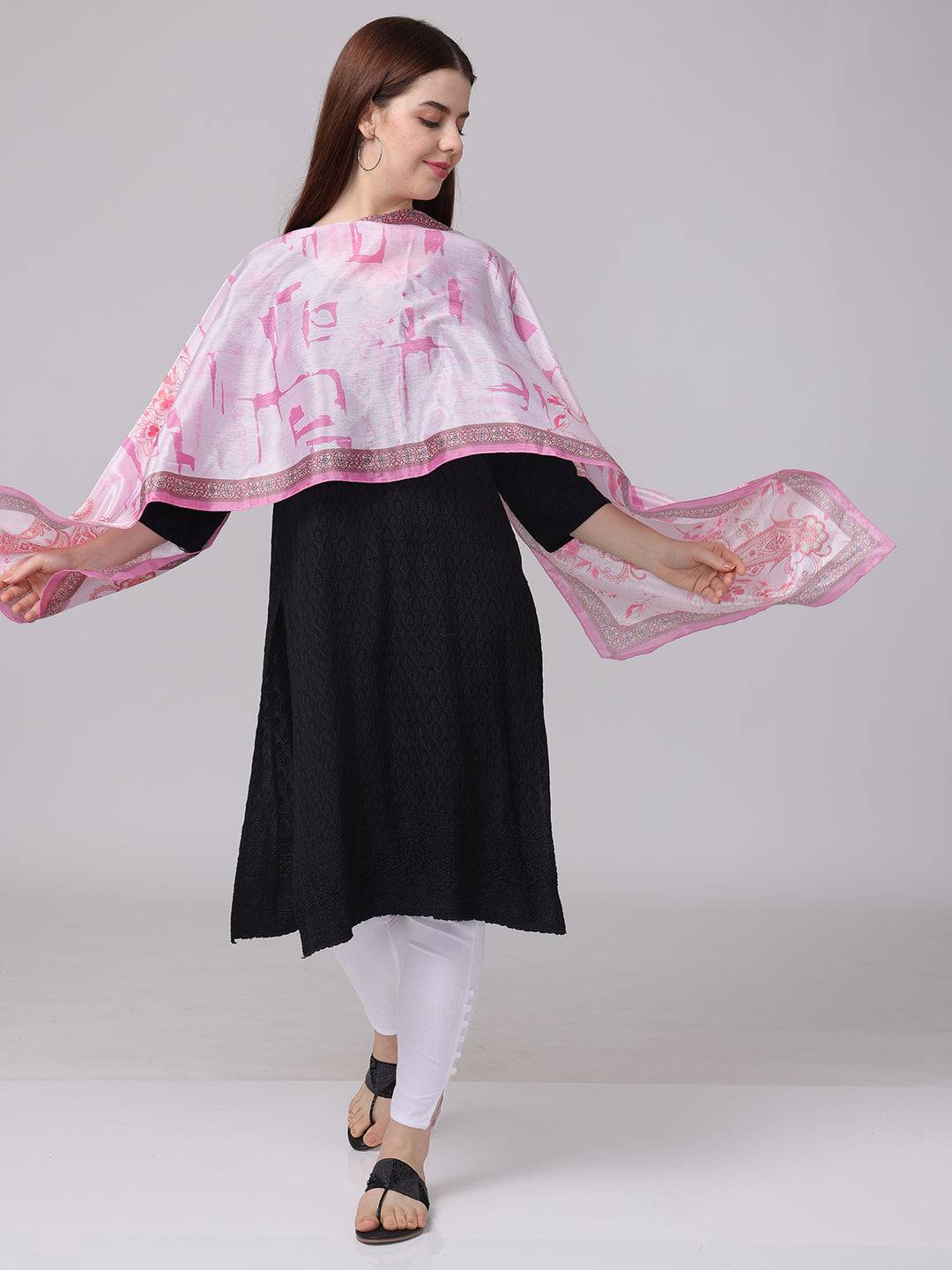 Pink paisley and floral scarf elegantly worn over black dress