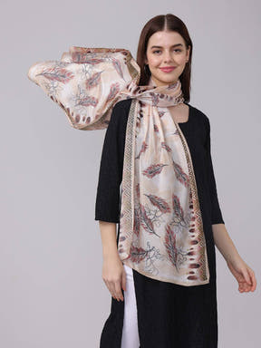 Close-up of feather pattern geometric borde scarf on model